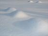 Snow covered grave stones