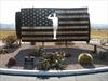 US flag with saluting man silhouette