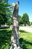 Tree trunk monument with easel