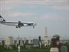 LOT airplane over cemetery